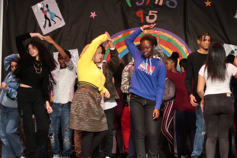 PS/MS 95 students dancing on stage. 